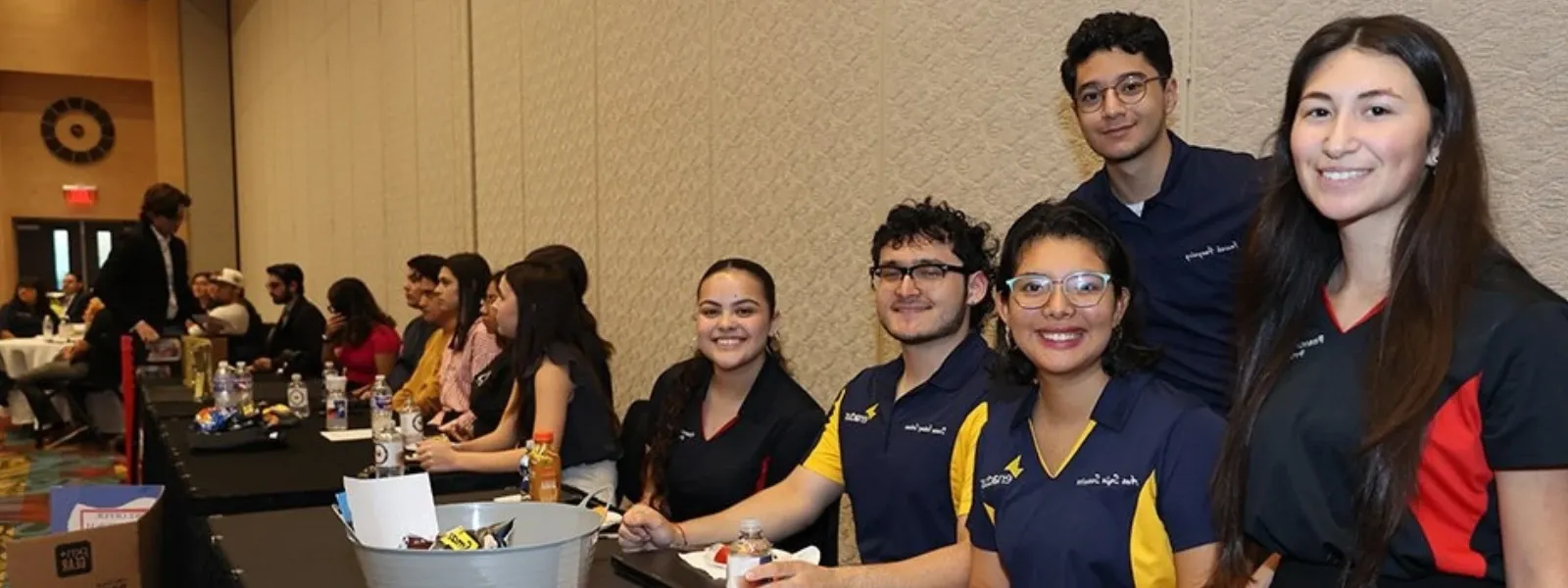 Members of Enactus organization smile at gathering